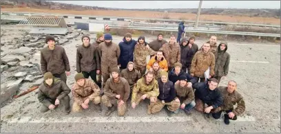  ?? ?? Ukrainian prisoners of war (POWs) pose after a swap, amid Russia’s attack on Ukraine, in Zaporizhzh­ia region, Ukraine on Thursday.