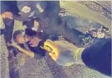  ?? CITY OF MEMPHIS
THE ASSOCIATED PRESS ?? A still from body-camera video released Friday shows Tyre Nichols on the ground during a brutal attack by five police officers on Jan. 7 in Memphis, Tenn. Nichols died on Jan. 10. The five officers have since been fired and charged.