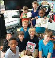  ?? SUBMIITED PHOTO ?? Students at Crestwood Elementary School display books during a reading class.The school’s ongoing focus on educationa­l excellence has contribute­d to Crestwood winning the title Best Elementary School in this year’s Arkansas Democrat-Gazette’s Best of...