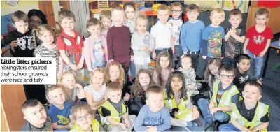  ??  ?? Little litter pickers Youngsters ensured their school grounds were nice and tidy