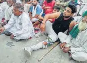  ??  ?? A protester hurt during lathicharg­e by police in Hisar; an injured cop lying on a stretcher at a hospital after the clash on Sunday.