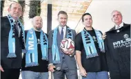  ??  ?? 2014: Beckham launches his MLS club bid with Garber (first left) and Miami-Dade mayor Gimenez (far right)