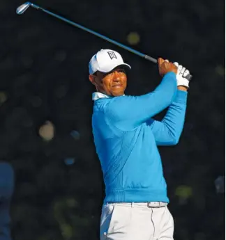  ?? THE ASSOCIATED PRESS ?? Tiger Woods tees off on the 13th hole during the second round of the Valspar Championsh­ip on Friday in Palm Harbor, Fla. Woods shot a 68 Friday and is one shot off the lead.