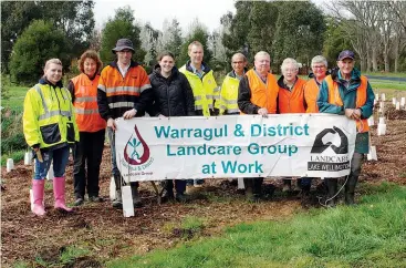  ??  ?? Above: Posing in front of their hard work following a planting day at Moroka Reserve, Warragul are (from left) Joanna De Lotto of Esso, Carolyn Ferguson and Tyson Dennis of Baw Baw Shire, Angela Snowdon of Landcare Australia, David Matchett and Dilip...