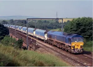  ??  ?? LEFT: National Power’s venture into rail was a short-lived affair, dogged by Railtrack’s safety inspectora­te and the company’s struggle to obtain third party insurance. It ran several route-learning trips to Immingham and Redcar, and started a flow from Wardley Opencast to Drax. This is illustrate­d by Class 59/2 59204, along with its 17 JMA wagons, as it crosses Relly Mill Viaduct making use of its 75mph maximum speed capability in July 1997 with the 4G04 0800 Sudforth Lane – Wardley Opencast.