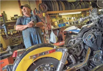  ?? LACY ATKINS, THE (NASHVILLE) TENNESSEAN ?? After 37 years of working in Wayne County, Mike Mitchell has a love for Russian motorcycle­s and for President Trump. Mitchell says he voted for Trump because of Obamacare.