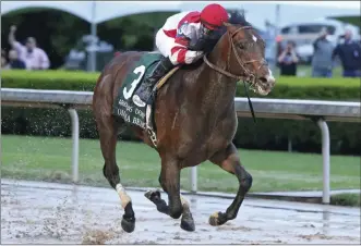  ?? The Associated Press ?? Omaha Beach, with Mike Smith up, wins the Arkansas Derby on Saturday in Hot Springs,
Ark. Smith will ride Omaha Beach in the Kentucky Derby.