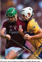  ??  ?? Clare’s Aron Shanagher (right) finds his route to goal stopped by David Burke; below, Joseph Cooney is congratula­ted by manager Micheál Donoghue