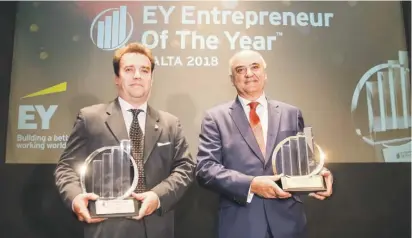  ??  ?? Shane Hunter (left) from AquaBioTec­h Group, winner of the 2018 EY Rising Star Award and Angelo Xuereb, Chairman of AX Holdings and 2018 Malta EY Entreprene­ur of the Year™