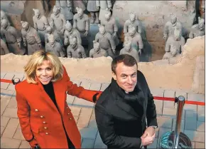 ?? CHARLES PLATIAU / REUTERS ?? French President Emmanuel Macron and his wife, Brigitte, visit the Museum of Qin Terracotta Warriors and Horses in Xi’an, Shaanxi province, on Monday.