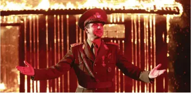  ??  ?? AN ACTOR plays Hitler in a scene from the film ‘I Do Not Care If We Go Down in History as Barbarians,’ which tells the story of an artist who reenacts a real-life ethnic cleansing perpetrate­d by the Romanian Army in 1941.