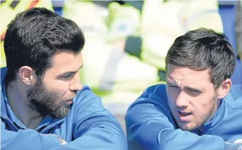  ?? Pictures: SNS Group. ?? Left: Dundee’s Mark O’Hara shows the determinat­ion the whole squad will have to find as the Dark Blues bid to move away from the danger area in the remaining six games; above: can Paul Hartley pull another vital win out of the hat?; St Johnstone pair...