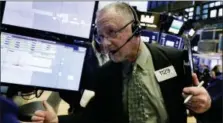  ?? RICHARD DREW — THE ASSOCIATED PRESS ?? Trader Robert Moran works on the floor of the New York Stock Exchange, Thursday.