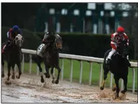  ?? (Arkansas Democrat-Gazette/Thomas Metthe) ?? Serengeti Empress (right), ridden by Joe Talamo, crosses the finish line to win the Azeri Stakes. Serengeti Empress won by 61/4 lengths over Mylady Curlin.