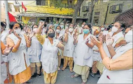  ?? PTI ?? Nurses from the Hindu Rao Hospital at a protest in New Delhi on Tuesday. Health workers from MCD-run hospitals are on strike over non-payment of salaries.