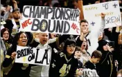  ?? ASSOCIATED PRESS ?? NEW ORLEANS SAINTS FANS cheer in the second half of a divisional playoff football game against the Philadelph­ia Eagles in New Orleans Sunday.