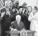  ?? DOUG MILLS/THE NEW YORK TIMES ?? President Joe Biden signs into law the Emmett Till Antilynchi­ng Act last Tuesday.