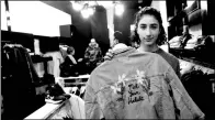  ?? NASSER SHIYOUKHI / AP ?? Yasmeen Mjalli displays a jacket with the slogan “Not Your Habibti (darling)” in Ramallah, the West Bank.