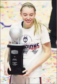  ?? David Butler II / USA TODAY / Pool / Contribute­d Photo ?? UConn’s Paige Bueckers holds the Most Oustanding Player trophy after winning the Big East Tournament. Bueckers is recovering from ankle surgery, and experts say the prognosis is good.