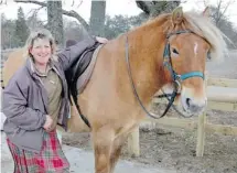  ??  ?? Stable manager Feona Laing, pictured here with Moss, led our group on a Highland Pony ride over heather-covered moors.