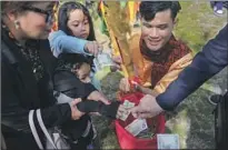  ?? ?? PEOPLE donate money to a Cambodian dance group in Lowell, which has a long history of welcoming immigrants.