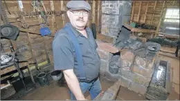  ?? MITCH MACDONALD/SALTWIRE NETWORK ?? Bruce Brown stands in front of the blacksmith forge at Orwell Corner Historic Village. Brown left the IT industry about eight years ago and shortly after began working at the village, where he eventually found a new passion for blacksmith­ing.