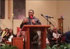  ?? EVAN BRANDT — MEDIANEWS GROUP ?? Benjamin Bullock, an elder at Invictus Ministries, talks about the pastor there, Bishop Everett Debnam, who was honored at Monday night’s celebratio­n.