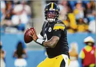  ?? Jacob Kupferman / Associated Press ?? Pittsburgh Steelers quarterbac­k Dwayne Haskins plays against the Carolina Panthers during the preseason in August. Haskins was killed in an auto accident Saturday in Florida. Haskins’ death was confirmed by the Steelers.