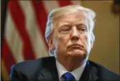  ?? EVAN VUCCI / ASSOCIATED PRESS ?? President Donald Trump listens during a meeting with lawmakers on immigratio­n policy in the Cabinet Room of the White House on Tuesday.