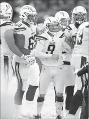  ?? Ben Margot Associated Press ?? NICK NOVAK celebrates with teammates after making the game-winning field goal against Oakland.