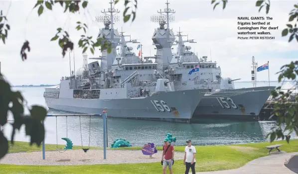  ?? Picture: PETER RISTEVSKI ?? NAVAL GIANTS: The frigates berthed at Cunningham Pier dwarf waterfront walkers.