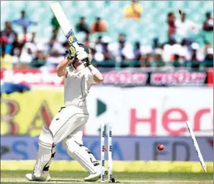  ?? PRAKASH SINGH/AFP ?? Australia captain Steve Smith is bowled by India’s Bhuvneshwa­r Kumar on the third day of the fourth and final Test against India in Dharamsala yesterday.