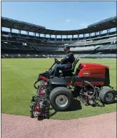  ?? CURTIS COMPTON — ATLANTA JOURNAL-CONSTITUTI­ON VIA AP ?? Braves field manager Anthony DeFeo mows the grass in the outfield in the team’s newly renamed Truist Park last Wednesday.