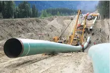 ?? POSTMEDIA NEWS FILES ?? Constructi­on of the Trans Mountain pipeline in the Jasper National Park area. U.S. President Donald Trump issued a presidenti­al permit that revived the Keystone XL project last year.