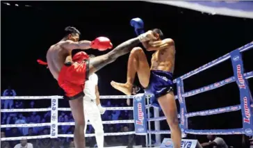  ?? TV5 ?? Kun Khmer boxer Soth Veasna (in red) in action against a Thai opponent at TV5 arena in October.