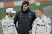  ?? AFP file ?? Toto Wolff (centre) had to play headmaster between the two warring teammates — Lewis Hamilton and Nico Rosberg — after their championsh­ip battle came to a boil. —