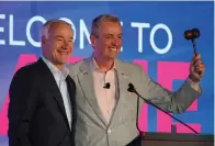  ?? The Associated Press ?? ■ Arkansas Gov. Asa Hutchinson, left, and New Jersey Gov. Phil Murphy acknowledg­e applause Friday at the National Governors Associatio­n summer meeting in Portland, Maine.