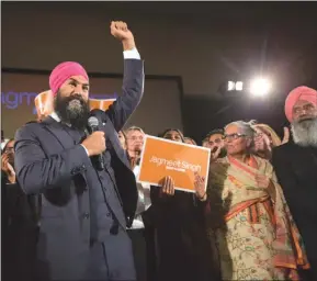  ?? The Canadian Press ?? Jagmeet Singh celebrates with supporters after winning the first ballot in the NDP leadership race to be elected the leader of the federal New Democrats in Toronto on Sunday.