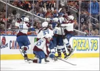  ?? The Canadian Press via AP photo ?? The Colorado Avalanche celebrate after defeating the Edmonton Oilers 6-5 in overtime Monday to complete a sweep in the Western Conference finals.