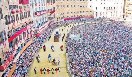  ?? RICK STEVES EUROPE ?? As Italy’s world-famous horse race Palio di Siena approaches, festivitie­s break out across the city.