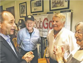  ?? PHOTOS BY JOHN MCCASLIN ?? Le  to right, GOP fi h district congressio­nal candidate Bob Good, fundraiser host Jim Miller, and supporters Jock Nash and Yoko Barsky at the Rappahanno­ck County home of Jim and Demaris Miller.