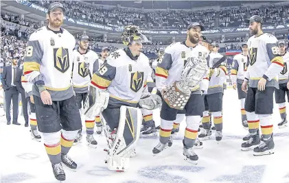  ?? AP ?? Golden Knights players celebrate after defeating the Jets to reach the Stanley Cup Finals in Winnipeg.