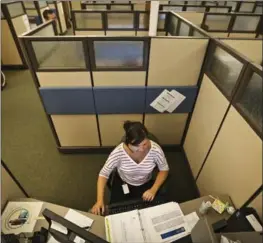  ?? RENEE JONES SCHNEIDER, MINNEAPOLI­S STAR TRIBUNE ?? The medical rationale for the standing desks took a hit in 2016. Researcher­s found that studies purporting to link health benefits with the furniture actually provide only ‘low quality evidence.’ Above, a traditiona­l office cube and seated worker.