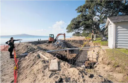  ?? Photos / Brett Phibbs ?? Constructi­on work on a Takapuna beach-front property unearthed steps below the high-tide mark.