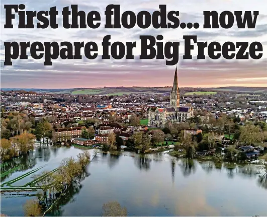  ?? ?? Praying for relief: Floodwater­s edge closer to Salisbury Cathedral and the surroundin­g houses in Wiltshire yesterday