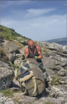  ??  ?? Main, nearly home. Davy reaches the end of the road; above right, Davy struggles with the barrel along the rocky shoreline; above left, Davy takes a well earned rest in a cave. All photograph­s: Fraser Aitchison.