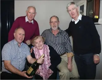  ??  ?? The late Mary Ann Lane, Ballydesmo­nd, pictured at her 100th birthday party with her sons Sean, Eamonn, Timmie, and Darby.