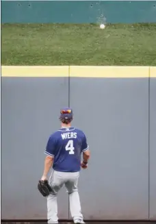  ?? AP PHOTO/JOHN MINCHILLO ?? San Diego Padres center fielder Wil Myers watches a home run hit by Cincinnati Reds’ Freddy Galvis in the second inning of a baseball game on Monday, in Cincinnati.