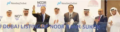  ?? — Supplied photo ?? Essa Kazim, John Iossifidis and other top officials at listing of Noor Bank’s sukuk on Nasdaq Dubai on Wednesday.