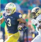  ?? MICHAEL CONROY/AP ?? Notre Dame WR Avery Davis heads to the end zone for a touchdown after a catch in front of Purdue safety Chris Jefferson on Saturday.